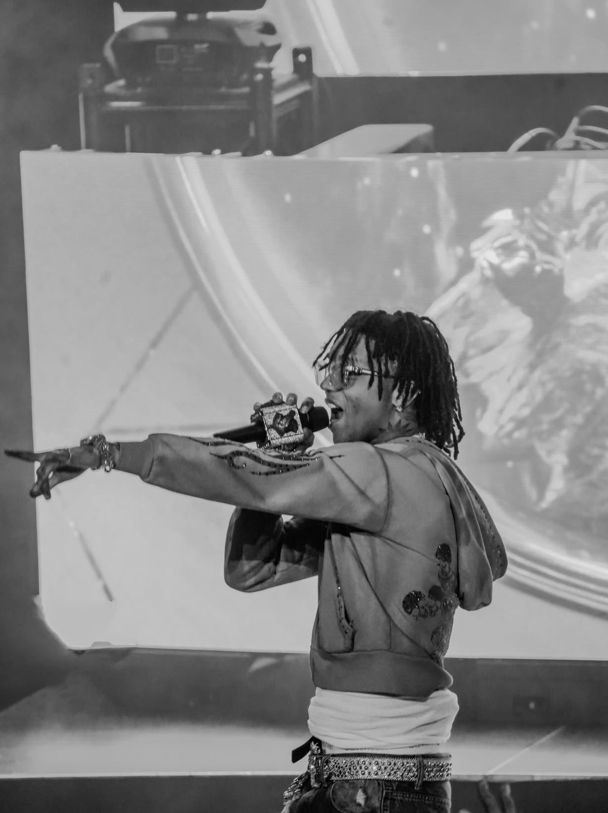 Performer pointing toward the crowd during a live set