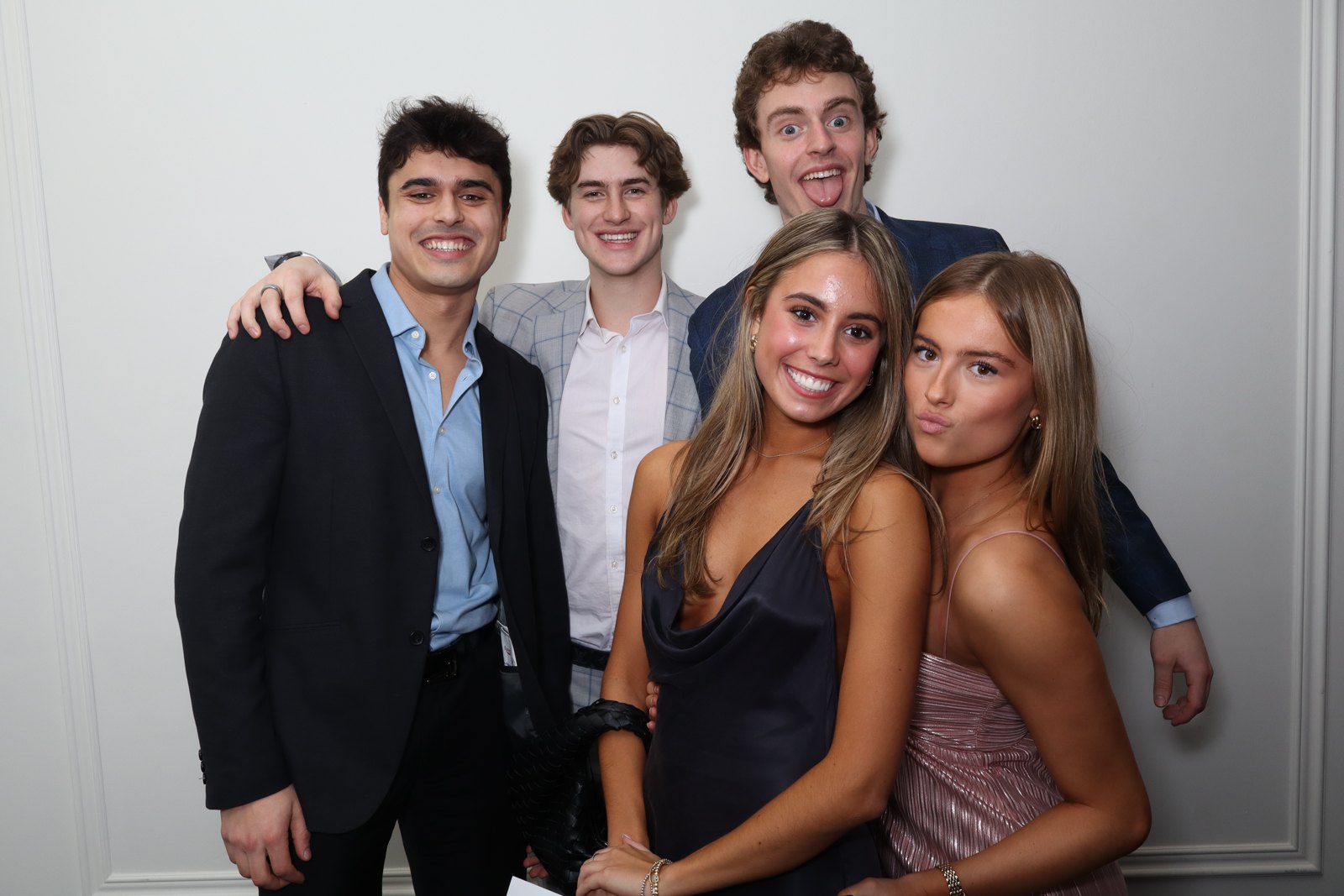 Five guests gathered for a photo booth portrait