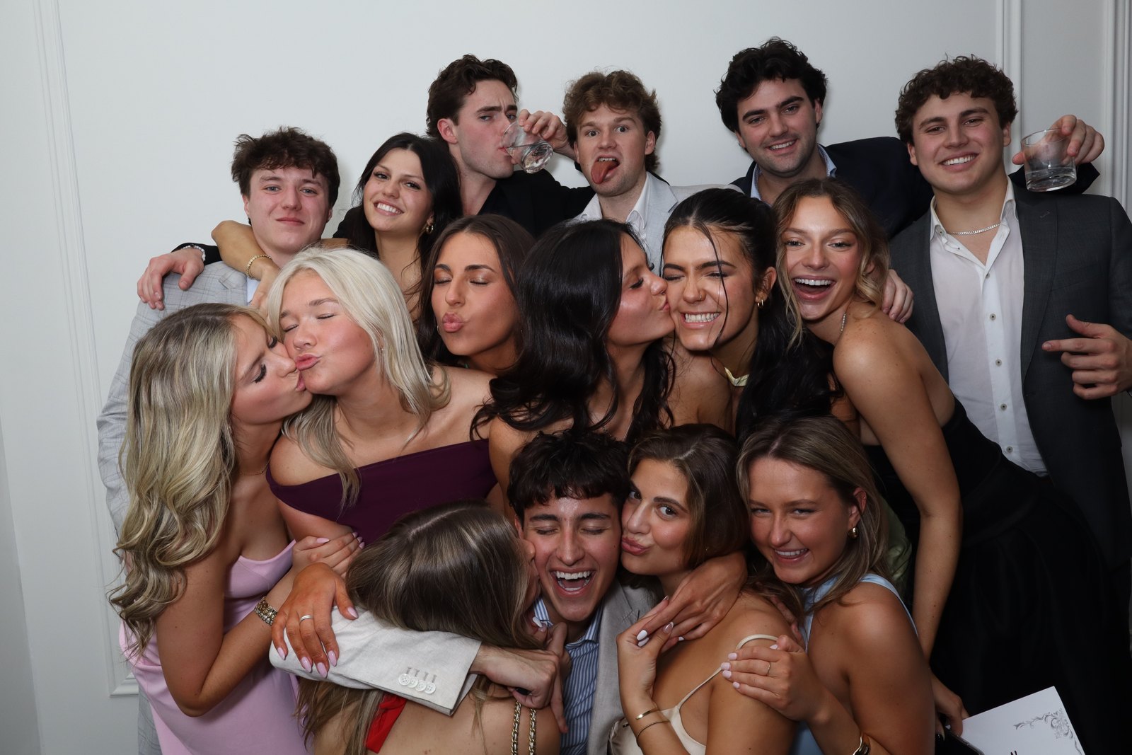 Group leaning in for a lively photo booth picture